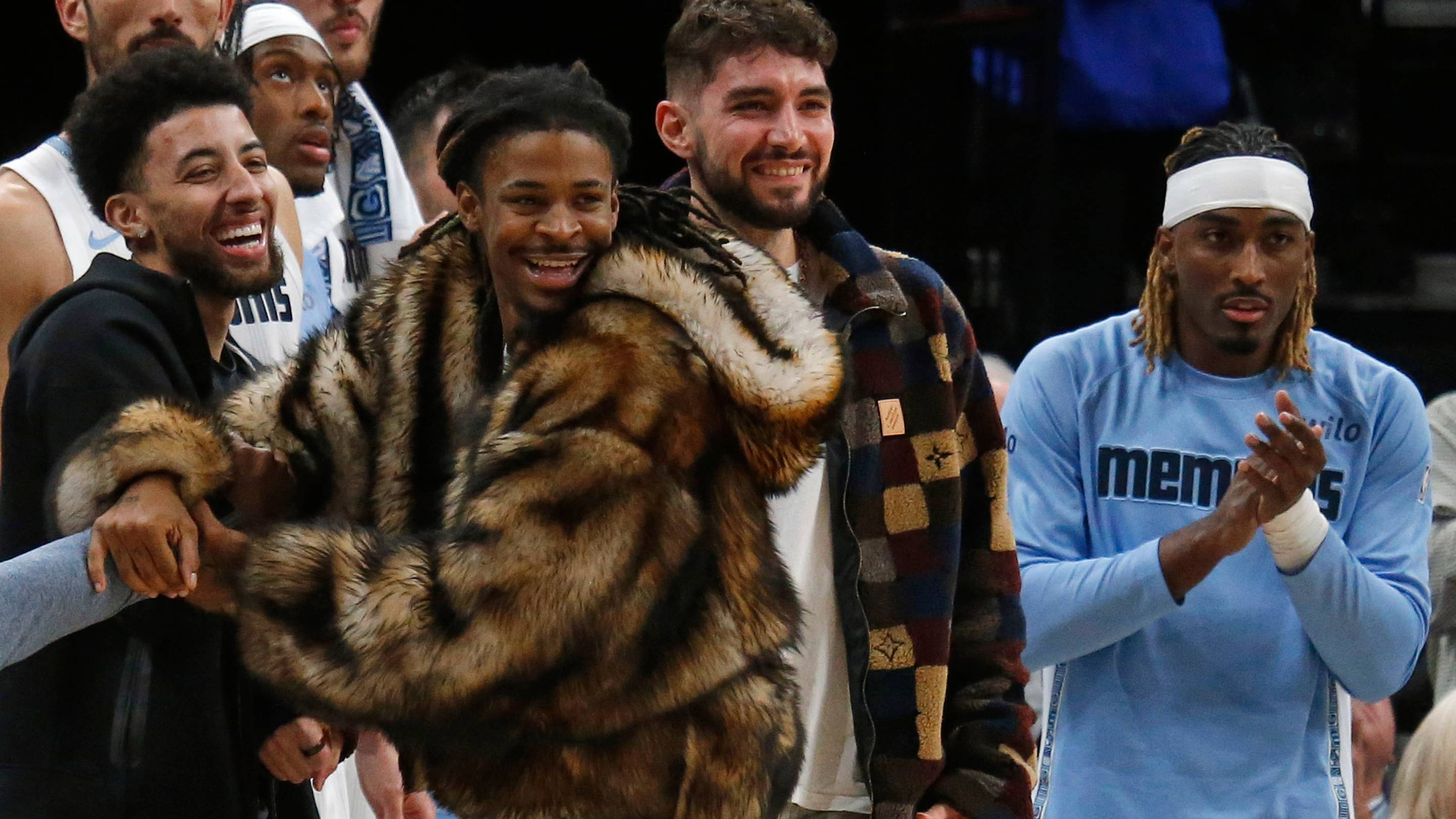 Dec 5, 2025; Memphis, Tennessee, USA; Memphis Grizzlies guard Scotty Pippen Jr., guard Ja Morant, guard Ty Jerome and guard Jahmai Mashack react form the bench during the fourth quarter against the Los Angeles Clippers at FedExForum. Mandatory Credit: Petre Thomas-Imagn Images