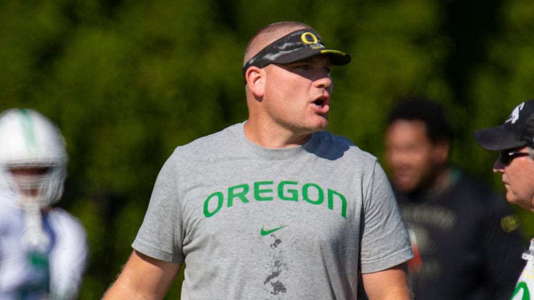 Oregon defensive coordinator Tosh Lupoi watches practice Wednesday Aug. 24, 2022 in Eugene, Ore.