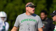 Oregon defensive coordinator Tosh Lupoi watches practice Wednesday Aug. 24, 2022 in Eugene, Ore.