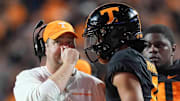 Tennessee head coach Josh Heupel talks to Tennessee quarterback Nico Iamaleava (8) on the sideline during a game between Tennessee and Kentucky at Neyland Stadium in Knoxville, Tenn., Saturday, Nov. 2, 2024.