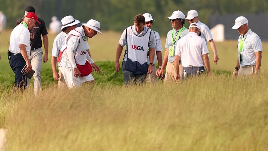 Officials, caddies and golfers search for the ball of Rasmus Neergaard-Petersen on the 14th hole during the first round of the U.S. Open.  | Bill Streicher-Imagn Images