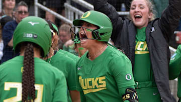 Oregon’s Rylee McCoy, center, celebrates a first-inning homer against Weber State during the Eugene NCAA Softball Regional May 16, 2025.