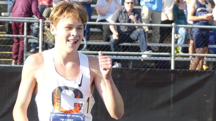 Crater senior Tayvon Kitchen celebrates after breaking the national record in the boys 3,200 meters Friday at the 24th Nike Jesuit Twilight Relays. Crater senior Tayvon Kitchen celebrates after breaking the national record in the boys 3,200 meters Friday at the 24th Nike Jesuit Twilight Relays.