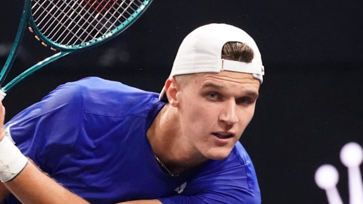 Jakub Mensik returns a shot