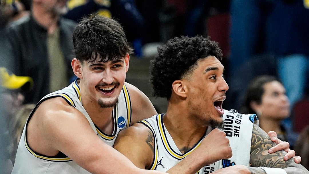 Michigan forward Yaxel Lendeborg (23) and center Aday Mara (15) cheer on against Tennessee during the second half of NCAA Tournament Elite 8 round at United Center in Chicago on Sunday, March 29, 2026.