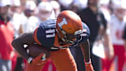 Sep 2, 2017; Champaign, IL, USA; Illinois Fighting Illini wide receiver Malik Turner (11) eludes Ball State Cardinals cornerback Myles Hannah (21) during the fourth quarter at Memorial Stadium. Mandatory Credit: Mike Granse-Imagn Images