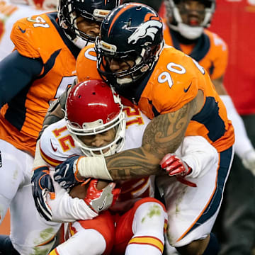 Dec 31, 2017; Denver, CO, USA; Kansas City Chiefs wide receiver Albert Wilson (12) is tackled by Denver Broncos nose tackle Kyle Peko (90) in the third quarter at Sports Authority Field at Mile High. 
