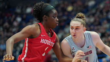 Jan 11, 2020; Hartford, Connecticut, USA; UConn Huskies guard Anna Makurat (24) drives the ball against Houston Cougars forward Bria Patterson (1) in the 1st half at XL Center. Mandatory Credit: David Butler II-Imagn Images