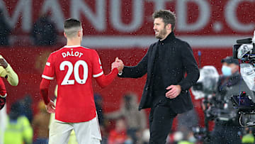 Michael Carrick congratulates Diogo Dalot