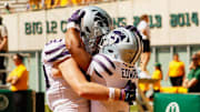 Kansas State running back Dylan Edwards celebrates with offensive lineman Will Anciaux after scoring a touchdown against Baylor. 