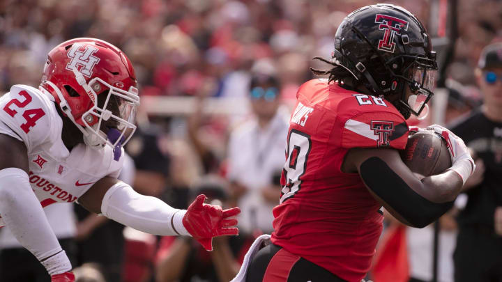 Texas Tech's running back Tahj Brooks (28) scores a touchdown against aces Houston in a Big 12 football game, Saturday, Sept, 30, 2023, at Jones AT&T Stadium.