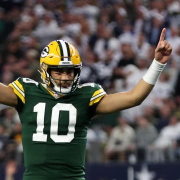 Green Bay Packers QB Jordan Love reacts after a touchdown at the Dallas Cowboys in the 2023 NFL playoffs.