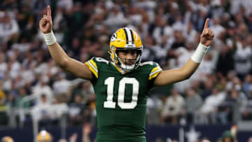 Jan 14, 2024; Arlington, Texas, USA; Green Bay Packers quarterback Jordan Love (10) reacts after a touchdown against the Dallas Cowboys in the first quarter for the 2024 NFC wild card game at AT&T Stadium. Mandatory Credit: Tim Heitman-Imagn Images