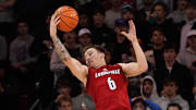 Jan 21, 2025; Dallas, Texas, USA; Louisville Cardinals guard Reyne Smith (6) grabs the rebound against the SMU Mustangs during the first half at Moody Coliseum. 