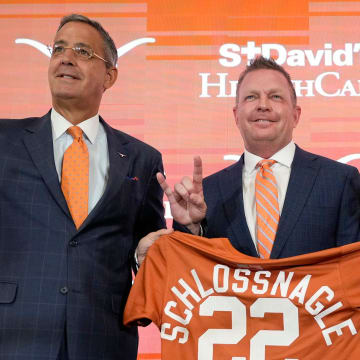 University of Texas baseball coach Jim Schlossnagle, second from left, is joined by UT Athletic Director Chris Del Conte, left to right, President Jay Hartzell and Chairman of the Board of Regents Kevin Eltife at his introductory news conference at the Frank Denius Family University Hall of Fame Wednesday June 26, 2024.