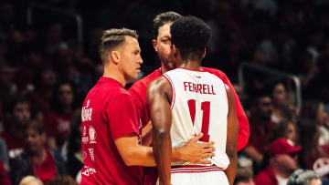 Coach Adam Ross talks with Assembly Ball players Jordan Hulls and Yogi Ferrell during Sunday's 68-55 win over Men of Mackey in The Basketball Tournament.