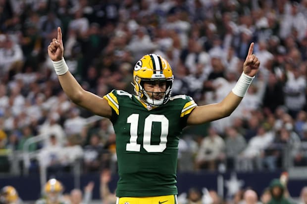 Green Bay Packers quarterback Jordan Love reacts after a touchdown against the Dallas Cowboys