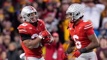 Nov 18, 2023; Columbus, Ohio, USA; Ohio State Buckeyes linebacker Cody Simon (30) celebrates a defensive stop on what was nearly an interception with safety Sonny Styles (6) during the NCAA football game against the Minnesota Golden Gophers at Ohio Stadium.