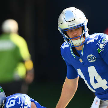 Oct 5, 2025; Seattle, Washington, USA; Seattle Seahawks quarterback Sam Darnold (14) on the field for warm ups prior to a game against the Tampa Bay Buccaneers at Lumen Field. 