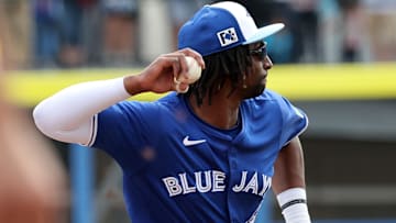 Feb 22, 2025; Dunedin, Florida, USA;  Toronto Blue Jays infielder Charles McAdoo (84) throws the ball to first base for an out during the fifth inning against the New York Yankees at TD Ballpark. Mandatory Credit: Kim Klement Neitzel-Imagn Images