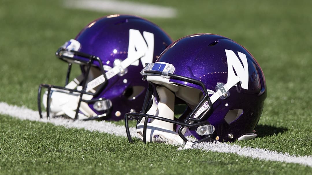 Sep 30, 2017; Madison, WI, USA; Northwestern Wildcats helmets on the field prior to the game against the Wisconsin Badgers at Camp Randall Stadium. Mandatory Credit: Jeff Hanisch-Imagn Images Sep 30, 2017; Madison, WI, USA; Northwestern Wildcats helmets on the field prior to the game against the Wisconsin Badgers at Camp Randall Stadium. Mandatory Credit: Jeff Hanisch-Imagn Images