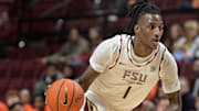 Jan 4, 2025; Tallahassee, Florida, USA; Florida State Seminoles forward Jamir Watkins (1) drives the ball to the net against the Syracuse Orange during the second half at Donald L. Tucker Center. Mandatory Credit: Melina Myers-Imagn Images