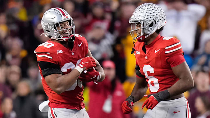 Nov 18, 2023; Columbus, Ohio, USA; Ohio State Buckeyes linebacker Cody Simon (30) celebrates a defensive stop on what was nearly an interception with safety Sonny Styles (6) during the NCAA football game against the Minnesota Golden Gophers at Ohio Stadium.