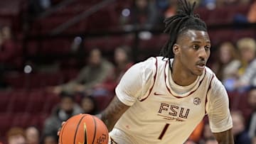 Jan 4, 2025; Tallahassee, Florida, USA; Florida State Seminoles forward Jamir Watkins (1) drives the ball to the net against the Syracuse Orange during the second half at Donald L. Tucker Center. Mandatory Credit: Melina Myers-Imagn Images