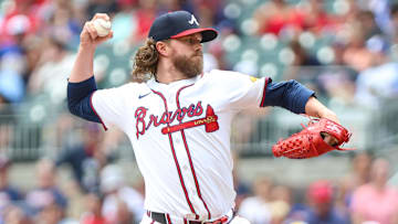 Aug 10, 2025; Cumberland, Georgia, USA; Atlanta Braves pitcher Pierce Johnson (38) pitches the ball against the Miami Marlins during the eighth inning at Truist Park. Mandatory Credit: Jordan Godfree-Imagn Images