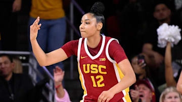 Feb 13, 2025; Los Angeles, California, USA; USC Trojans guard JuJu Watkins (12) celebrates hitting a 3-point shot during an NCAA basketball game against the UCLA Bruins at Galen Center.