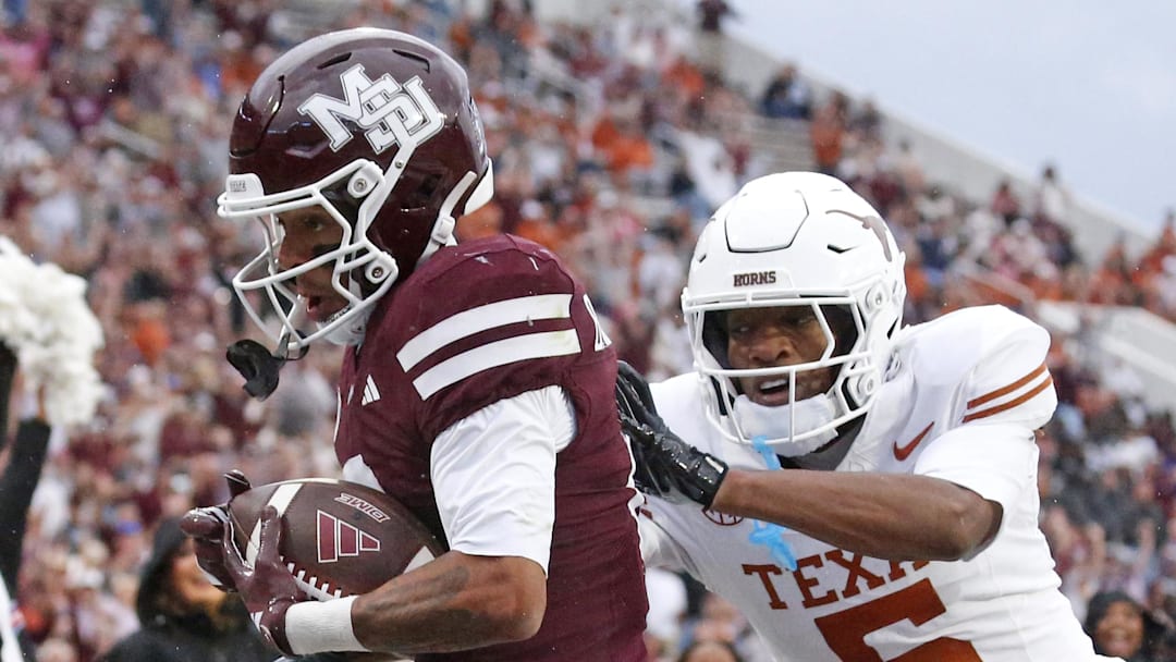 Mississippi State wide receiver Brenen Thompson (0) catches the ball for a touchdown over Texas defensive back Malik Muhammad (5) during the second quarter at Davis Wade Stadium at Scott Field.
