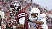 Mississippi State wide receiver Brenen Thompson (0) catches the ball for a touchdown over Texas defensive back Malik Muhammad (5) during the second quarter at Davis Wade Stadium at Scott Field.