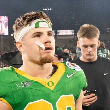 Oregon inside linebacker Bryce Boettcher walks off the field as the Oregon Ducks face the Ohio State Buckeyes Wednesday, Jan. 1, 2025, in the quarterfinal of the College Football Playoff at the Rose Bowl in Pasadena, Calif.