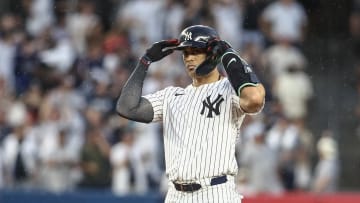 Jun 22, 2024; Bronx, New York, USA;  New York Yankees designated hitter Giancarlo Stanton (27) gestures after hitting a double against the Atlanta Braves in the fourth inning at Yankee Stadium. Mandatory Credit: Wendell Cruz-USA TODAY Sports