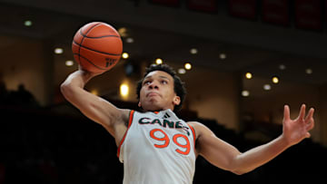 Feb 1, 2025; Coral Gables, Florida, USA; Miami Hurricanes guard Divine Ugochukwu (99) dunks against the Notre Dame Fighting Irish during the second half at Watsco Center. Mandatory Credit: Sam Navarro-Imagn Images