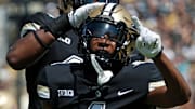 Purdue Boilermakers defensive back Markevious Brown (1) and linebacker Clyde Washington (42) celebrate a defensive stop against the Fresno State Bulldogs in West Lafayette, Ind.