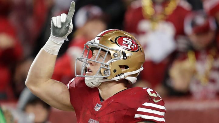 San Francisco 49ers running back Christian McCaffrey (23) celebrates scoring a third quarter touchdown against the Green Bay Packers during their NFC divisional playoff football game Saturday, January 20, 2024, at Levi's Stadium in Santa Clara, California.