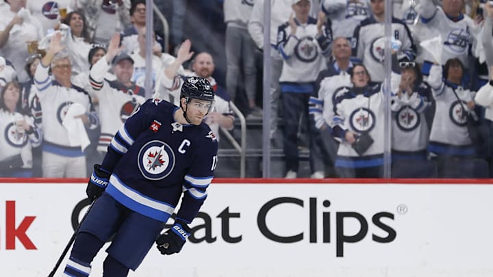 Apr 21, 2024; Winnipeg, Manitoba, CAN; Fans celebrate after a goal by Winnipeg Jets center Adam Lowry (17) against the Colorado Avalanche during the first period of game one in the first round of the 2024 Stanley Cup Playoffs at Canada Life Centre. Mandatory Credit: James Carey Lauder-Imagn Images