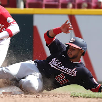 Jun 5, 2022; Cincinnati, Ohio, USA; Washington Nationals catcher Keibert Ruiz (20) steals second against Cincinnati Reds third baseman Brandon Drury (22) during the eighth inning at Great American Ball Park.