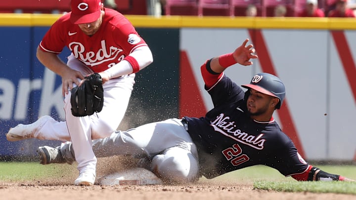 Jun 5, 2022; Cincinnati, Ohio, USA; Washington Nationals catcher Keibert Ruiz (20) steals second against Cincinnati Reds third baseman Brandon Drury (22) during the eighth inning at Great American Ball Park.