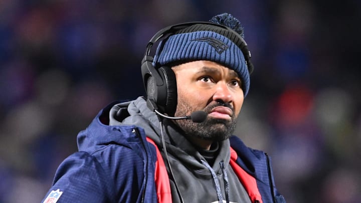 New England Patriots coach Jerod Mayo reacts to a play on the sidelines.
