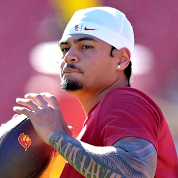 Oct 11, 2025; Los Angeles, California, USA;  USC Trojans quarterback Jayden Maiava (14) warms up prior to the game against the Michigan Wolverines at United Airlines Field at the Los Angeles Memorial Coliseum. Mandatory Credit: Jayne Kamin-Oncea-Imagn Images