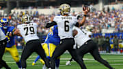 Nov 2, 2025; Inglewood, California, USA; New Orleans Saints quarterback Tyler Shough (6) throws downfield against the Los Angeles Rams during the first half at SoFi Stadium. 