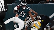 Jan 12, 2025; Philadelphia, Pennsylvania, USA; Philadelphia Eagles cornerback Quinyon Mitchell (27) intercepts a pass against Green Bay Packers wide receiver Bo Melton (80) during the second half in an NFC wild card game at Lincoln Financial Field. Mandatory Credit: Eric Hartline-Imagn Images