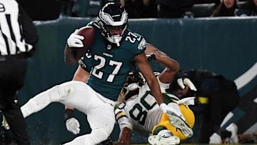 Jan 12, 2025; Philadelphia, Pennsylvania, USA; Philadelphia Eagles cornerback Quinyon Mitchell (27) intercepts a pass against Green Bay Packers wide receiver Bo Melton (80) during the second half in an NFC wild card game at Lincoln Financial Field. Mandatory Credit: Eric Hartline-Imagn Images