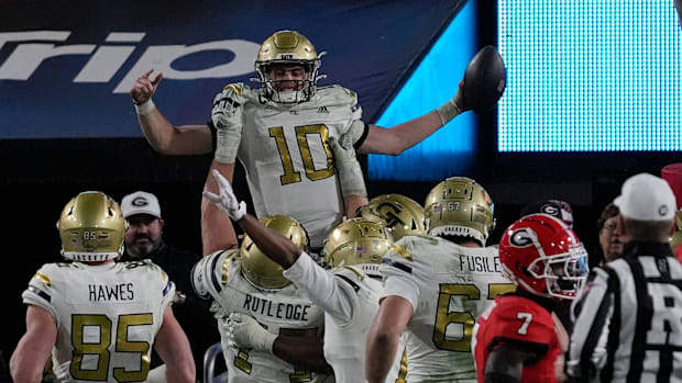 Georgia Tech quarterback Haynes King (10) celebrates with his teammates after scoring touchdown during the second half of a N