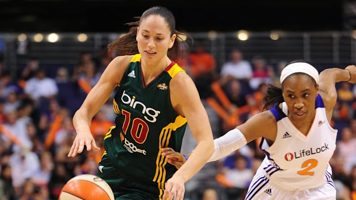 Sep 17, 2011; Phoenix, AZ, USA; Seattle Storm guard Sue Bird (10) handles the ball against Phoenix Mercury guard  Temeka Johnson (2) during the second half at the US Airways Center.  The Mercury defeated the Storm 92 - 83. Mandatory Credit: Jennifer Stewart-Imagn Images
