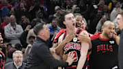 Mar 27, 2025; Chicago, Illinois, USA; Chicago Bulls guard Josh Giddey (3) celebrates with teammates after making the game-winning three point basket against the Los Angeles Lakers during the second half at United Center. Mandatory Credit: David Banks-Imagn Images