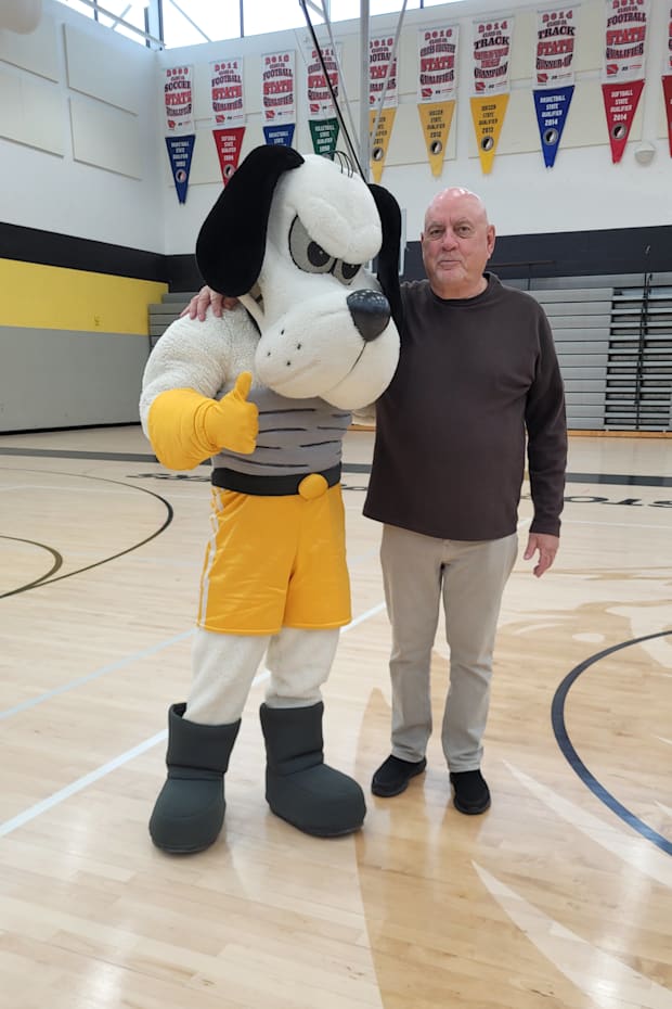 Richard Butschi, right, longtime Center Point and CPU (Iowa) high school art teacher, created the Stormin' Norman mascot.