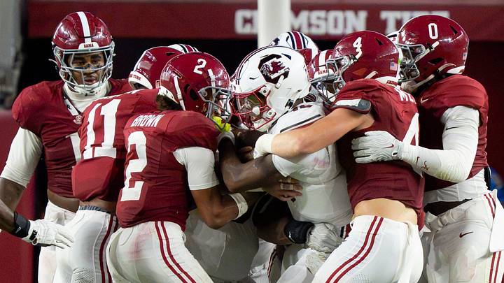 Sep 26, 2026; Tuscaloosa, AL, USA;  Alabama defensive back Zabien Brown (2) and Alabama linebacker Luke Metz (4), joined by teammates, stop South Carolina quarterback LaNorris Sellers (16) at Saban Field at Bryant Denny Stadium. Mandatory Credit: Gary Cosby Jr.-Tuscaloosa News